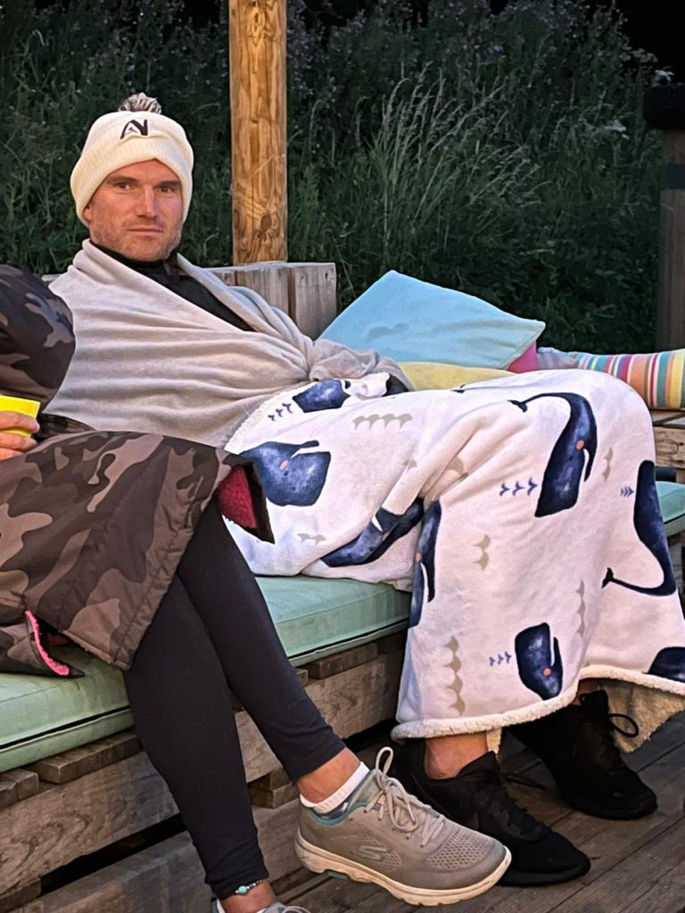 Family camping trip celebrating Dani's sister's 25th birthday, shortly after John's second procedure — a moment of quiet sadness behind family celebrations